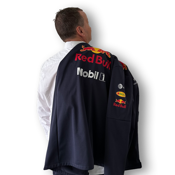 Picture of the back of Darring wearing a Formuna 1 jacket
