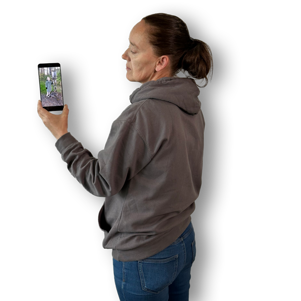 Picture of the back of Brenda holding a pic of her granddaughter