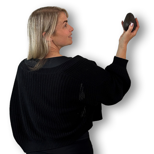Picture of the back of Sarah holding an avocado