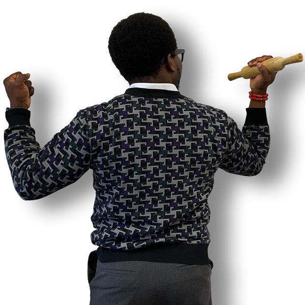 Picture of the back of Mayowa holding a rolling pin