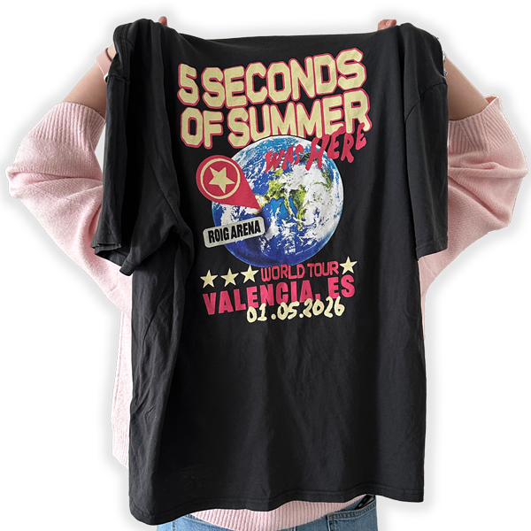 Picture of the back of Kirsty holding a 5SOS t-shirt
