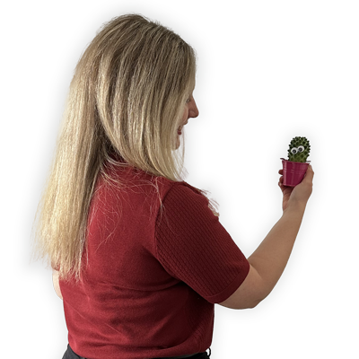 Picture of the back of Rea holding a plant