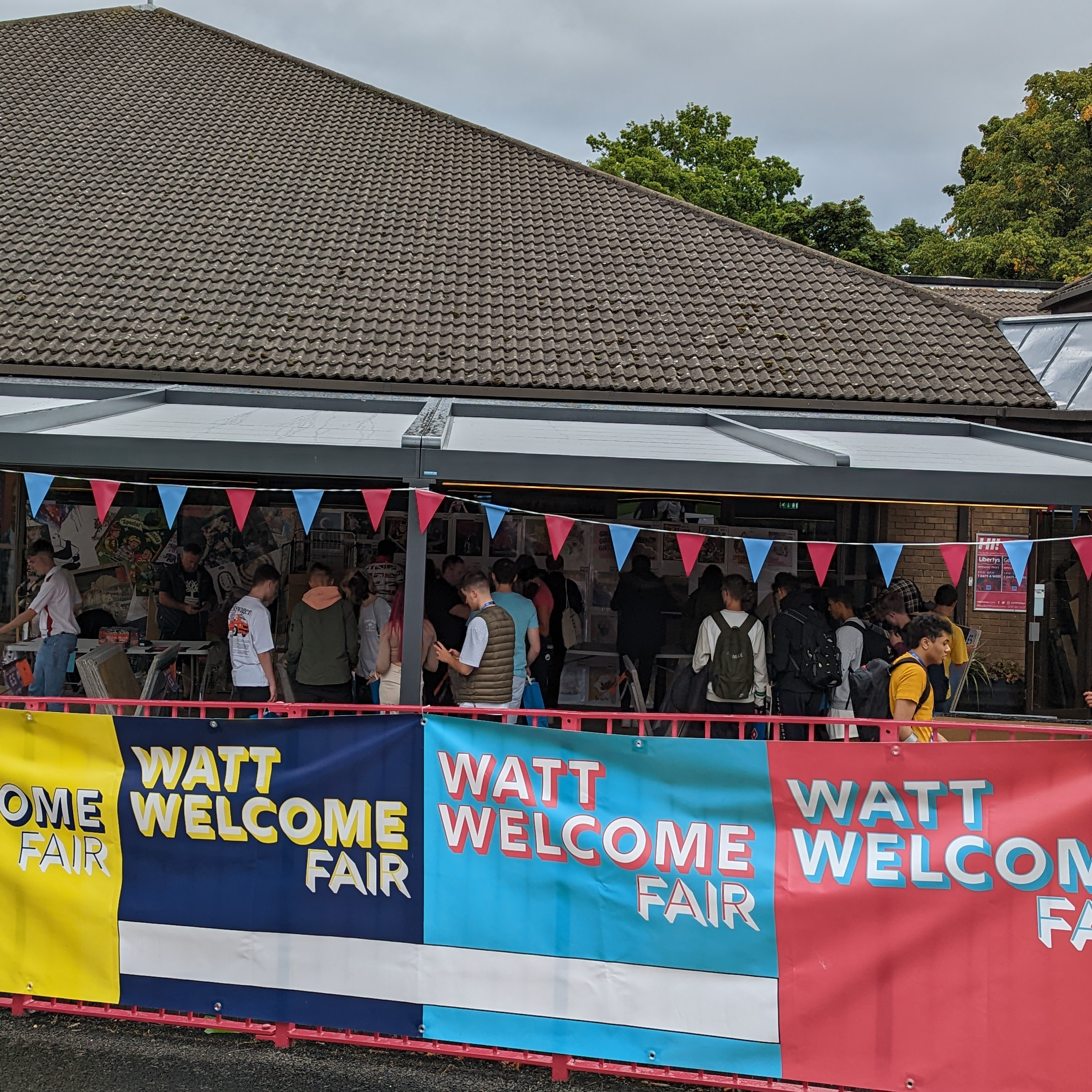 exterior shot of a fair filled with commercial stalls