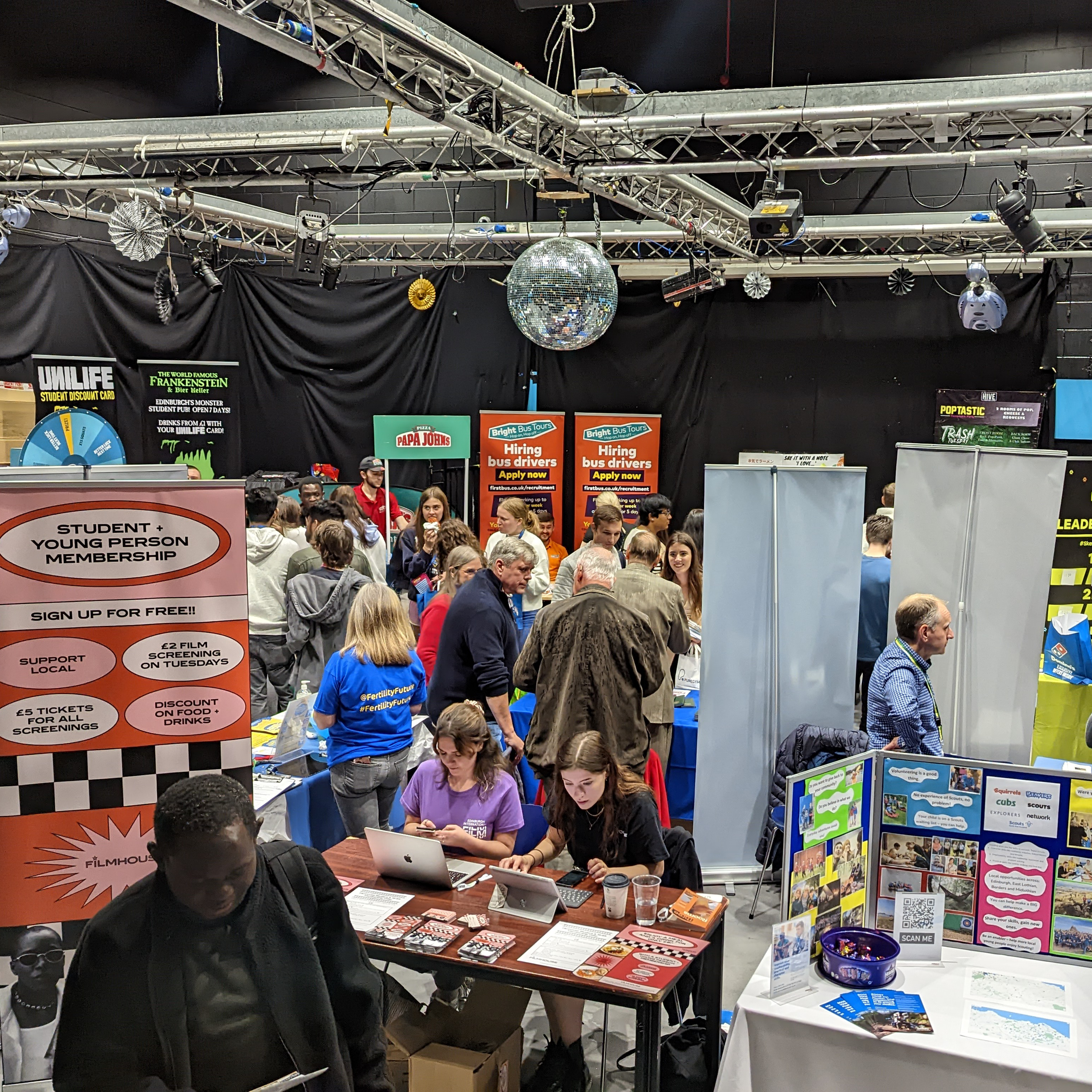 Interior shot of a commercial fair filled with students